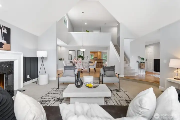 The bright, airy, and open layout connects the front family room, dining rooms, and upstairs loft in a cohesive and functional fashion.