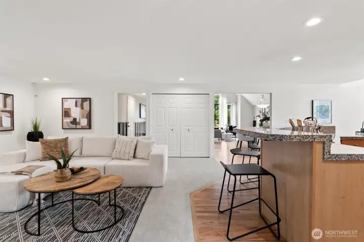 The kitchen flows seamlessly into the rear living room.