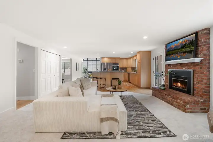 Enjoy this cozy rear living room with gas fireplace.