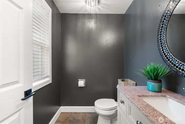 A downstairs powder room completes the first floor.