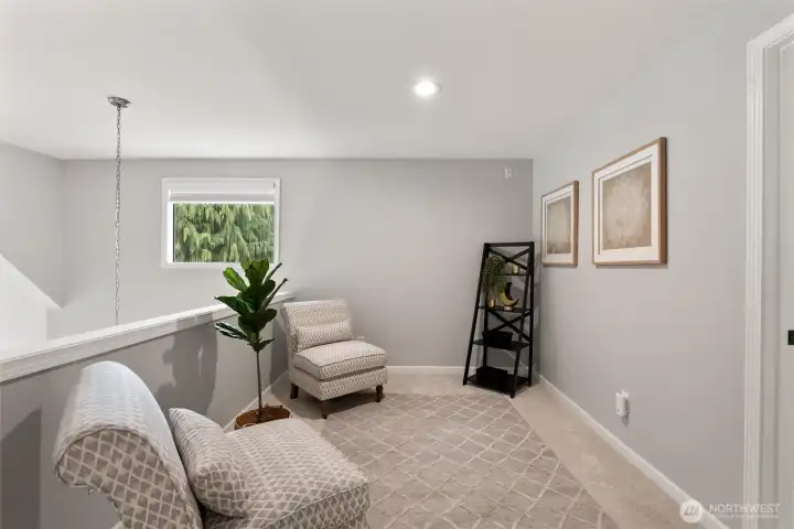 The upstairs loft provides flexibility for an additional seating or reading nook, an office, or den.