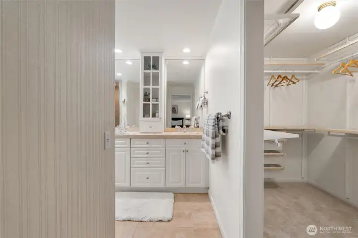 Connected to the primary bedroom, the ensuite walk-in closet and 5-piece bathroom.