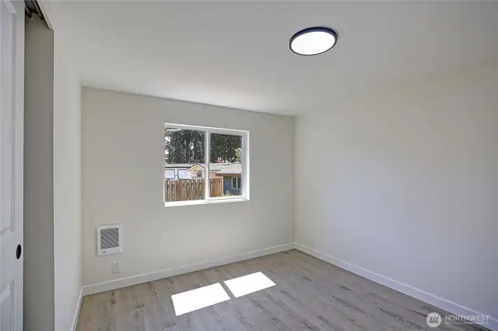 Comfortable guest bedroom with closet.