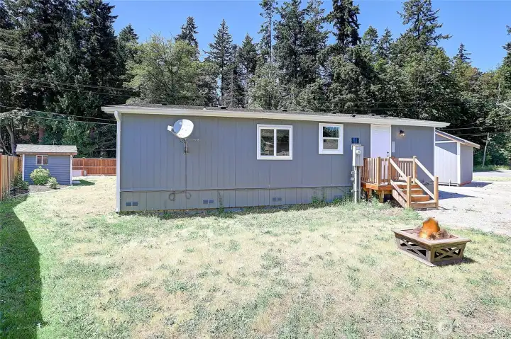 Private backyard with plenty of space for relaxing, gardening, or entertaining.