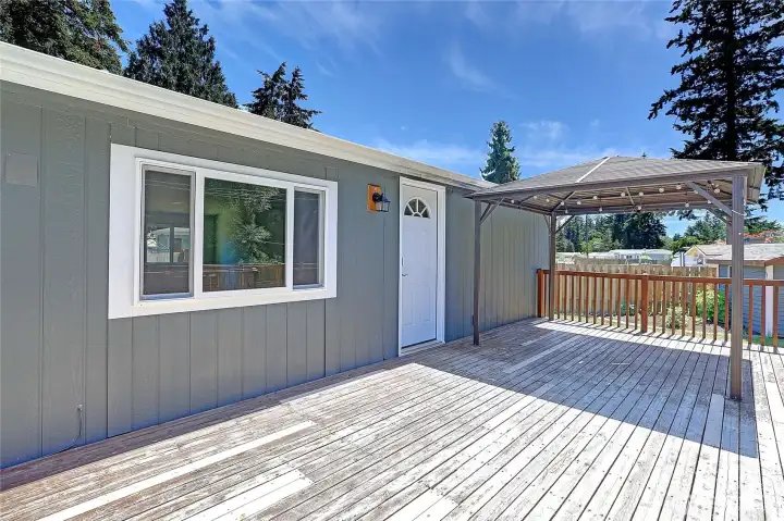 Enjoy outdoor living rain or shine on the covered deck.