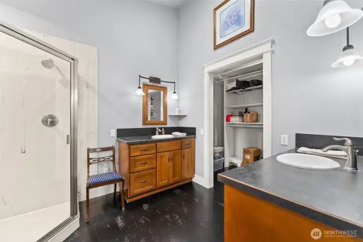 En-Suite primary bath with dual sinks and vanities