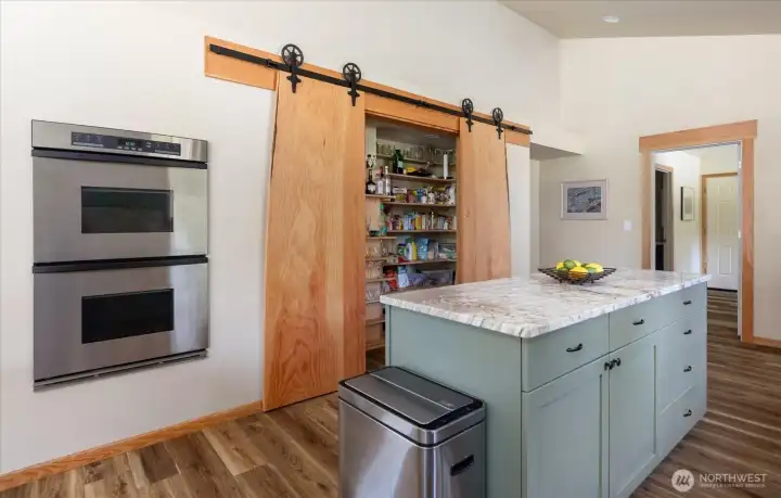 Kitchen with walk-in pantry. Pantry doors are custom made Douglas Fir Kitchen with walk-in pantry. Pantry doors are custom made Douglas Fir