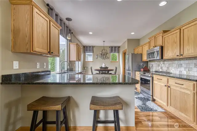 Spacious kitchen features an eating bar.