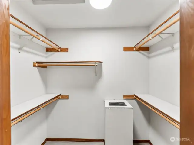 Primary walk in closet with laundry chute