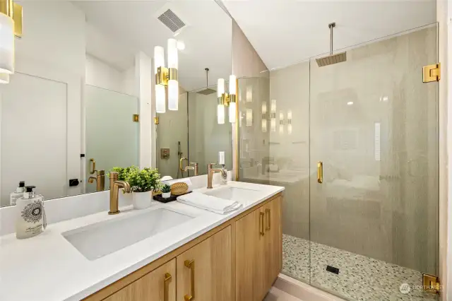 Primary luxury bath with heated floors and walk-in shower w/rain head shower