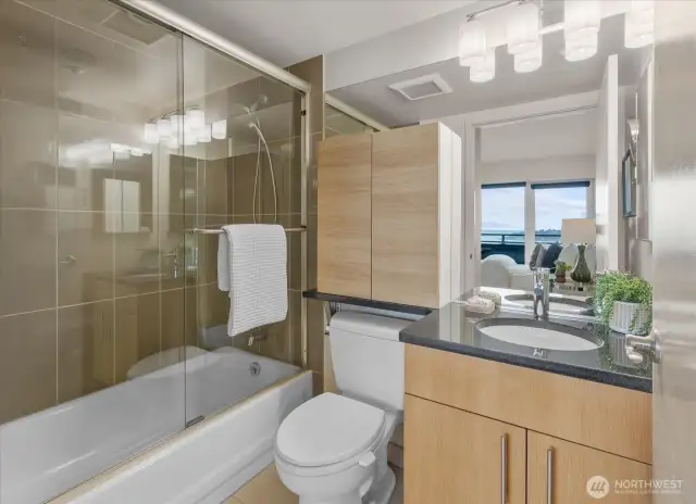 Indulge in the comfort and convenience of your full bathroom, complete with a bathtub and shower, just steps away from your bedroom. Grooming becomes a breeze in this thoughtfully designed space, offering everything you need to start or end your day with ease. Whether you prefer a quick shower or a relaxing soak, this bathroom is your personal retreat for rejuvenation and pampering.