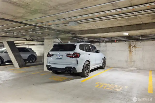Experience the convenience and modernity of your designated garage parking spot, equipped with an electric car charging station. Whether or not you're a fan of Elon Musk, your car will love the ease of staying charged and ready to go. Embrace the future of driving with this seamless addition to your home, making eco-friendly living effortless and stylish.