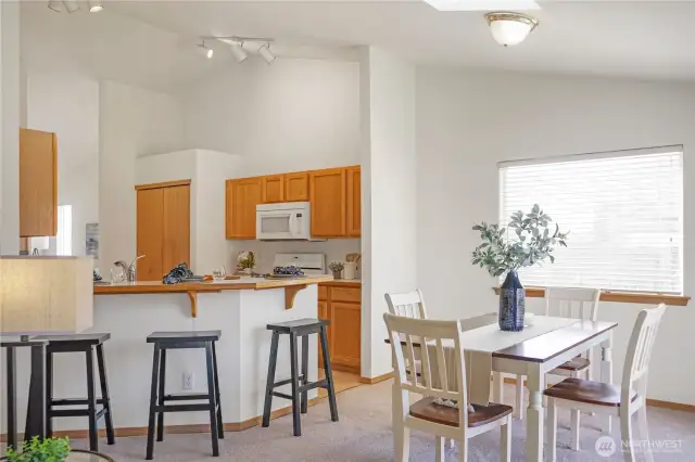 Dining Room and Kitchen. Sliding Patio Door To Backyard On Right