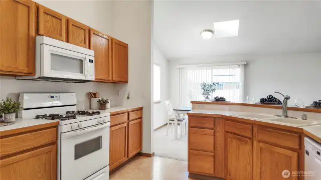 Kitchen View To Open Concept Dining Room And Family Room