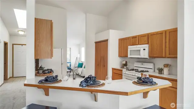 View From Open Concept Dining Room And Family Area. 3 Barstools And Counter