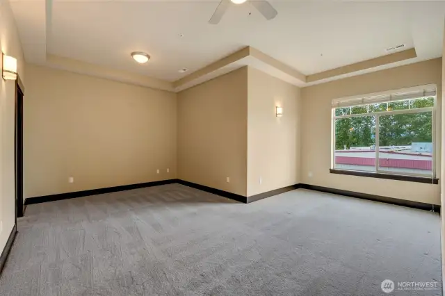 An oversized primary suite featuring a pop out- perfect for an at home office or a place to lounge.