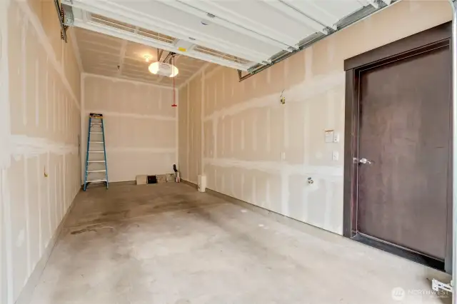 Oversized garage fits two cars and has storage space.
