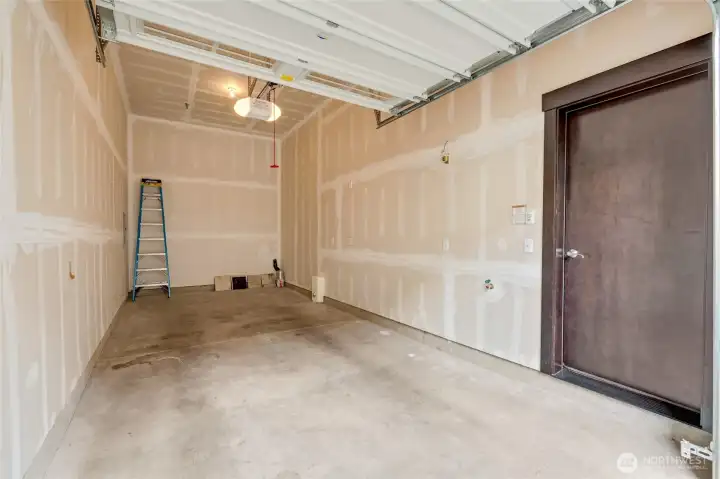 Oversized garage fits two cars and has storage space.