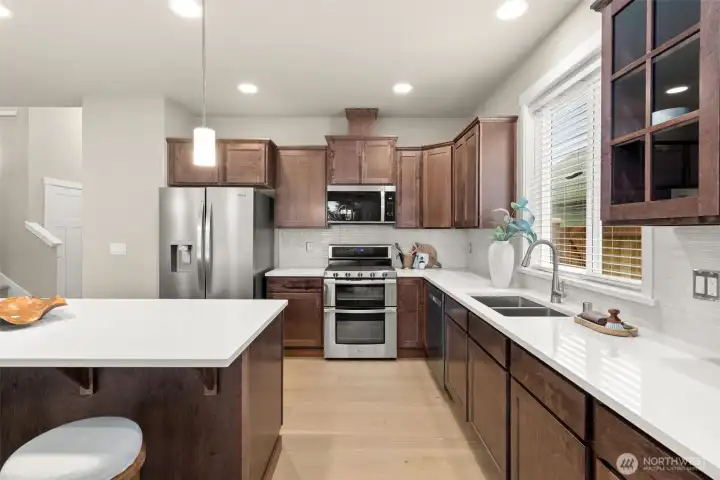 Kitchen features abundance of cabinets for storage of all your kitchen essentials.