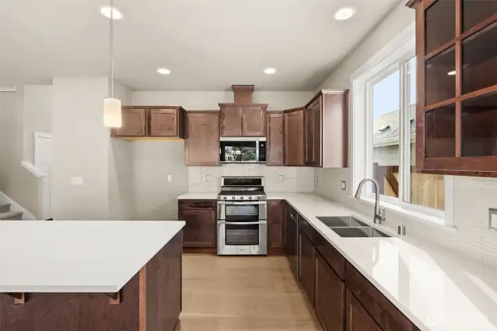 Kitchen features abundance of cabinets for storage of all your kitchen essentials.