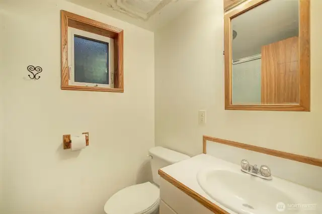 This full-sized bathroom is on the lower floor.