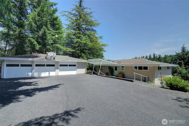 The driveway from the main road is fully paved all the way up to the house.