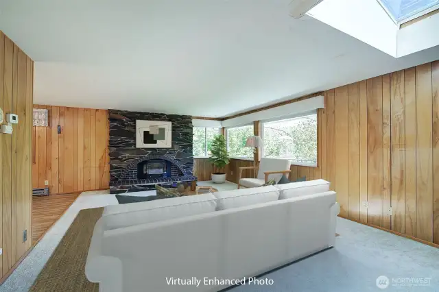 The focal point for this main floor living room is a beautiful stone fireplace.