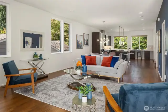 Open layout with seamless flow between living spaces. Large windows allowing ample natural light to fill the space.