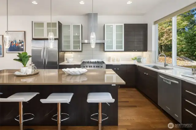 Kitchen featuring ample island seating, soft-close cabinets and 36" Verona range.