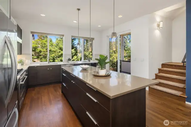Kitchen with covered deck accessible via sliding glass doors, perfect for BBQ.