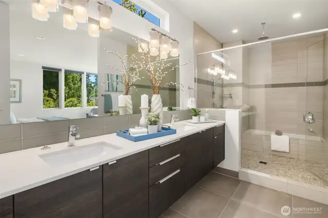 Ensuite bathroom with double vanity and spacious shower + bath.