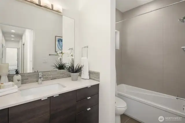 Full bathroom adjacent to bedroom 3.