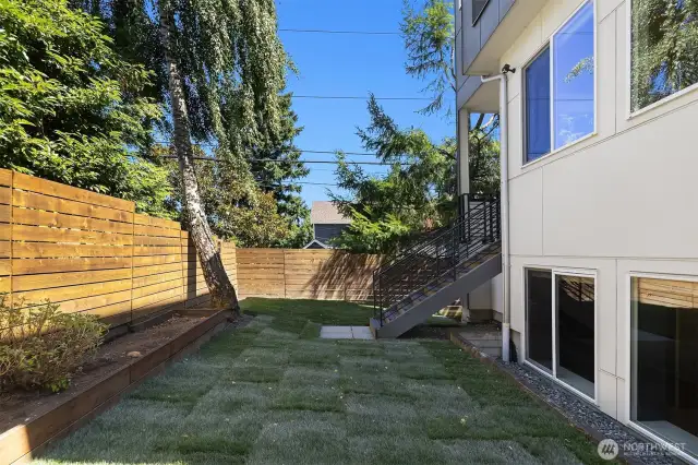 Spacious, fully fenced back yard.