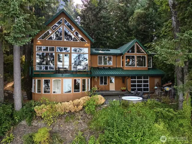 Most living space is on the main level, with loft overlooking great room, and family room on lower level.