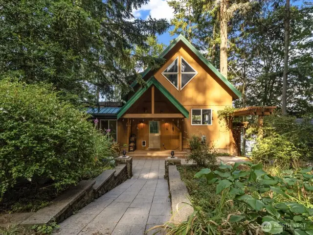 Inviting walkway to patio and entry.