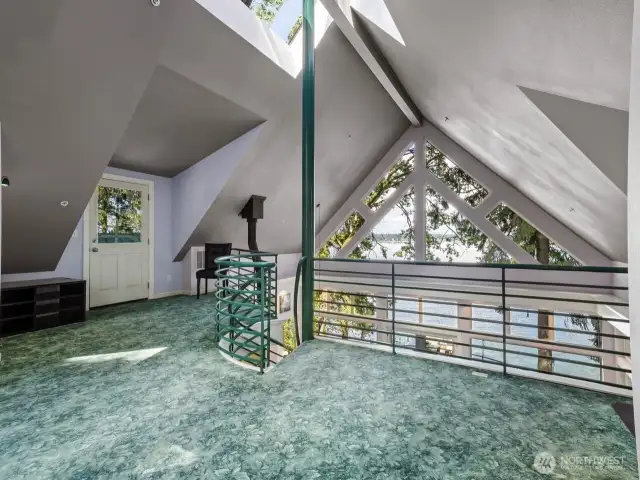 Loft overlooks great room and offers flex space. It’s been a bedroom, office and play space. It’s also provides access to the rooftop deck.