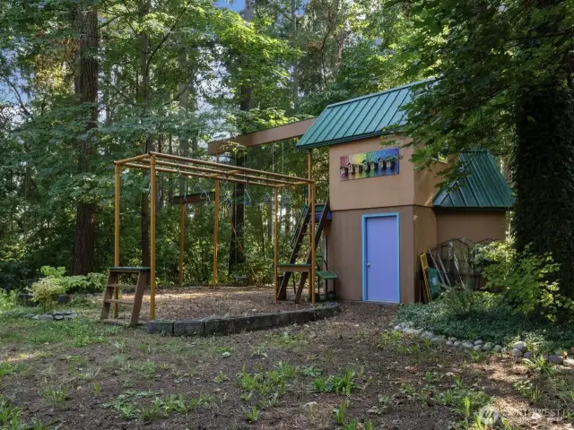 One of a kind play structure will impress the kids (and possibly the adults, too), and lower level is currently used as potting shed.