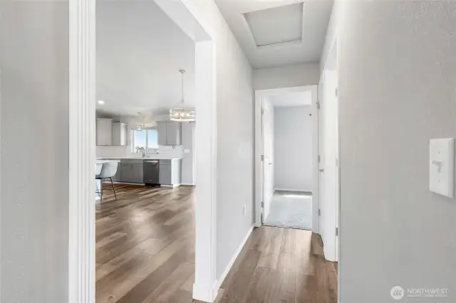 Split plan with two bedrooms on the opposite side of the great room.