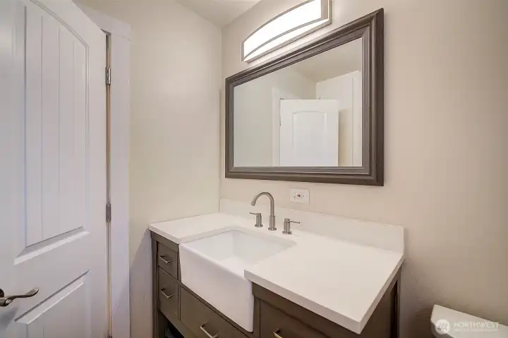 Main bath in main floor hallway.