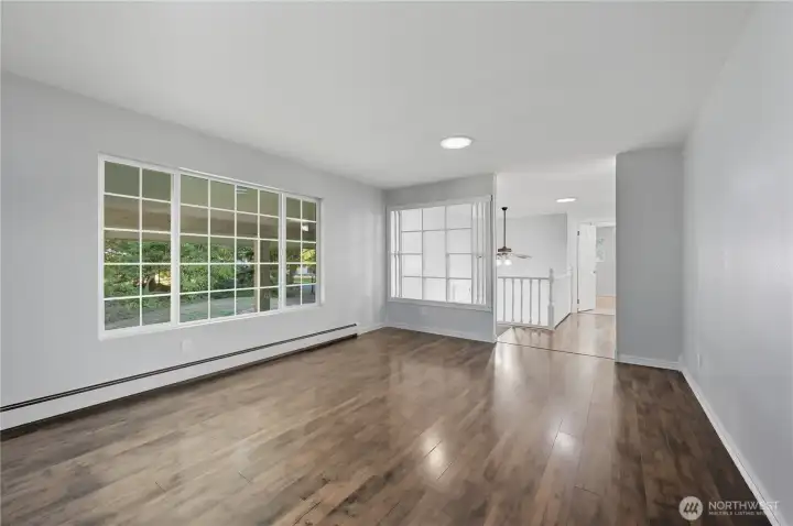 Living Room at top of entry. Gas radiant floor heaters throughout home