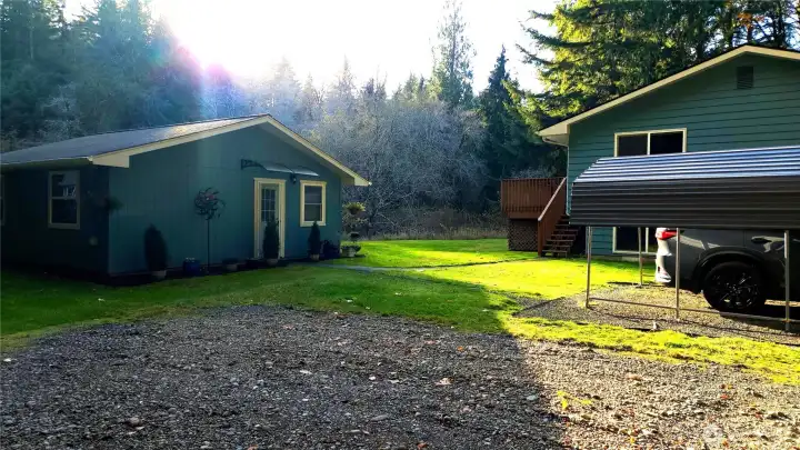 Here you can see the close proximity of the little house to the big house. The gravel area at the front of this photo can be used for RV parking ... or swap the carport to this area?