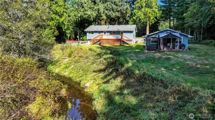 Yes, this little creek is on your property, nicely fenced off from the upper yard to keep pets and young'uns away.