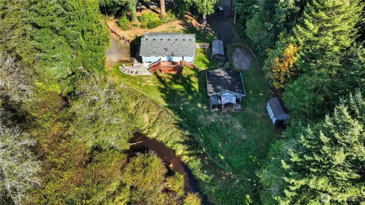 The entire parcel is serene and peaceful. Large enough for all the toys and events. The sellers say listening to the creek and enjoying the birds that visit is one of their favorite pastimes.