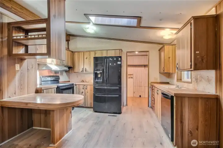 Kitchen with view of back door mud room