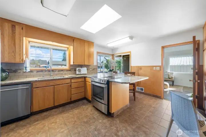 Updated kitchen with granite counters.