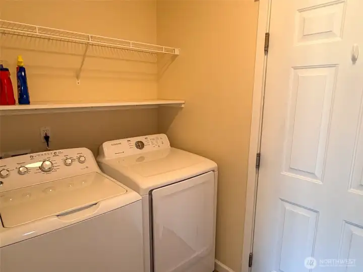 Conveniently located utility room off the kitchen with a door to the garage.