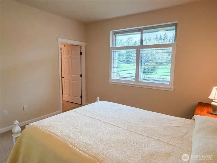 Ensuite 3/4 bath & walk-in closet in primary bedroom.