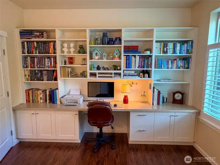 Beautiful built-in shelves and desk in third bedroom that is being used as an office.