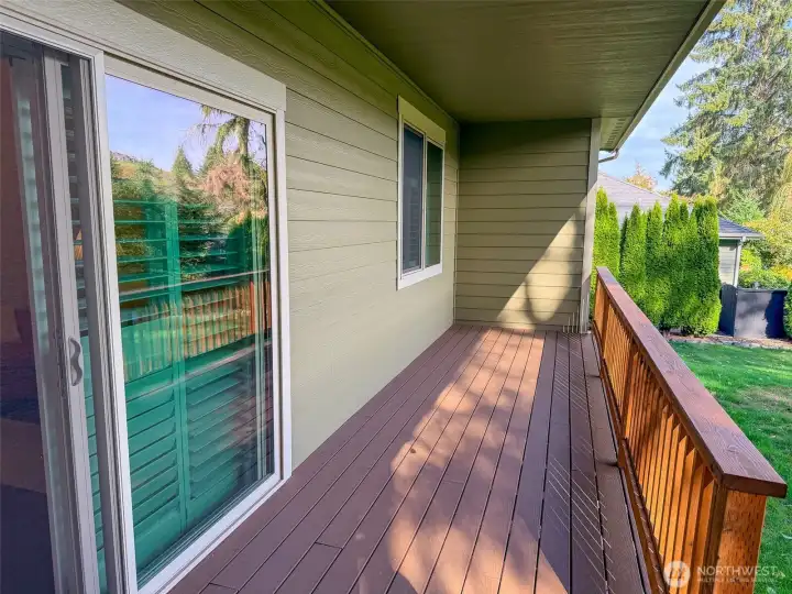 Long, covered deck easily lends to outdoor cooking, dining, and entertainment.