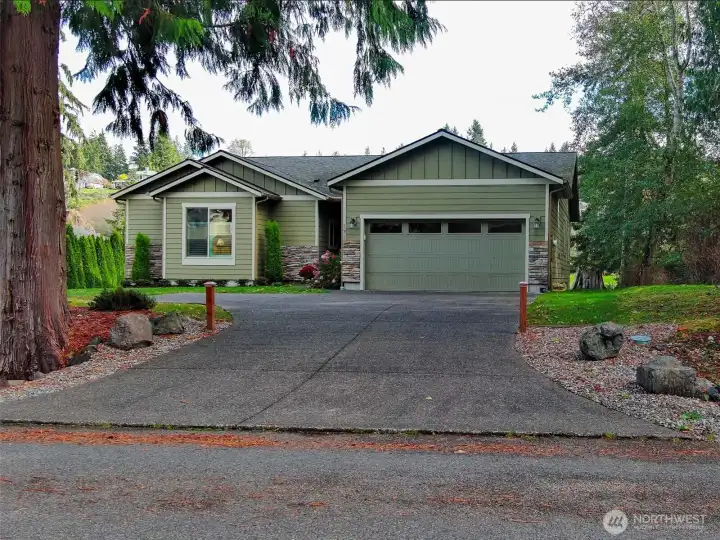 Exquisite exposed aggregate concrete driveway & pathway to the front door.